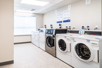 Modern Laundry Room at All Saints Apartments, Colorado, 80219